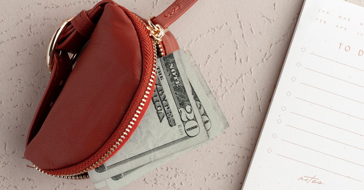 Red purse with US Dollars underneath